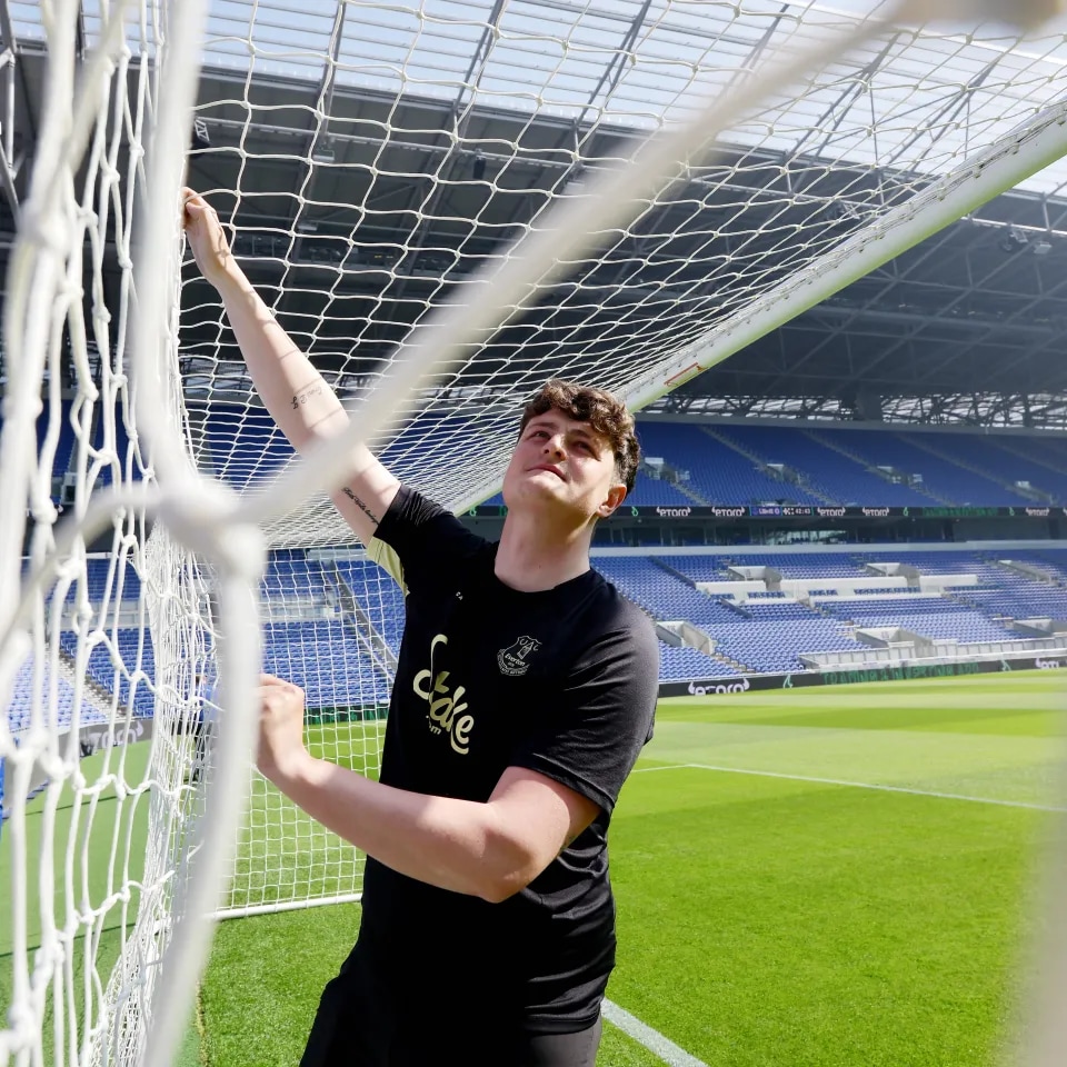 Young man inside a goal post