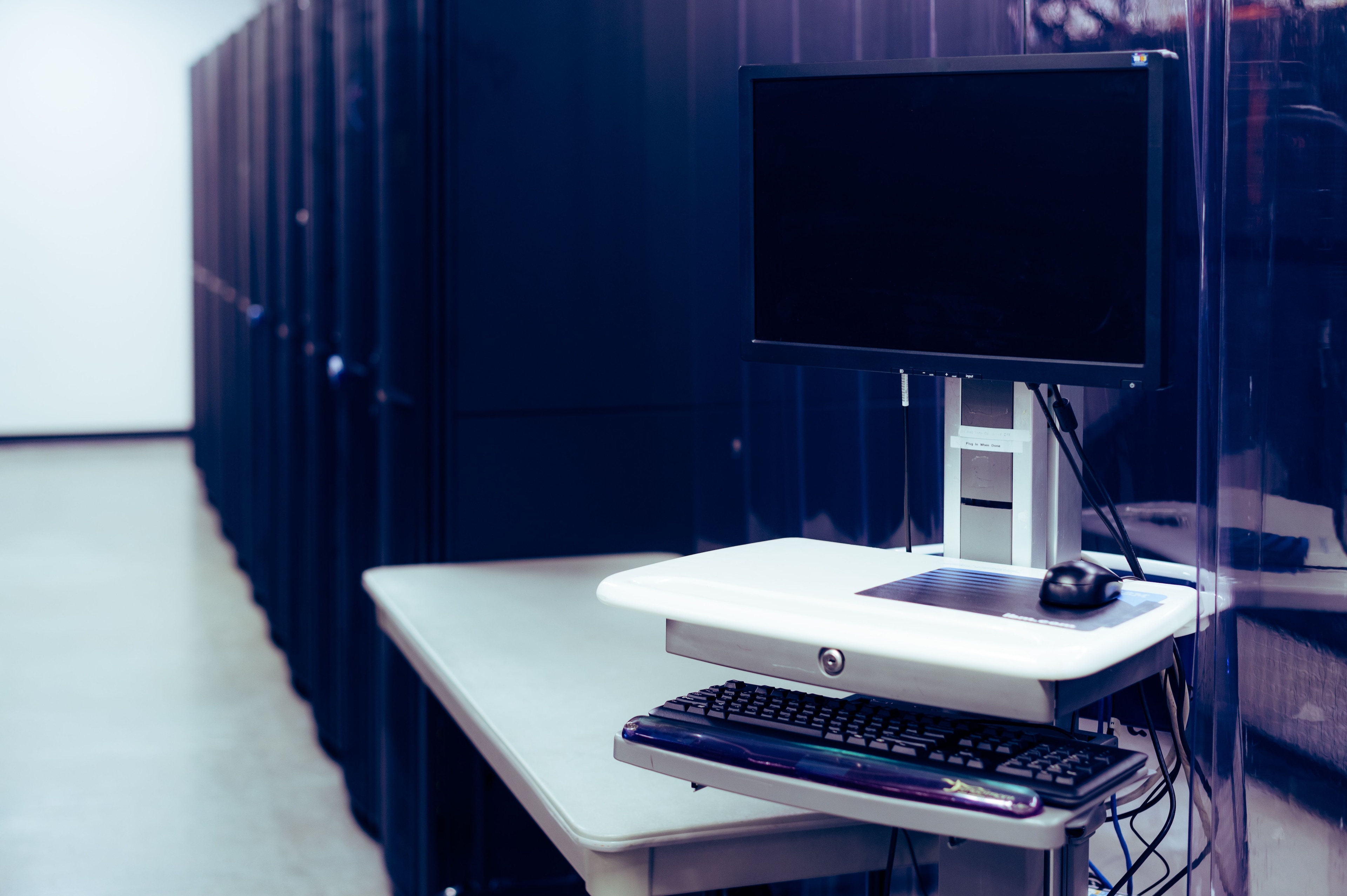 Data centre infrastructure. Photo: Brett Sayles / Pexels. Source: https://www.pexels.com/photo/modern-computer-placed-near-server-racks-5092815/ Licence: https://www.pexels.com/license/ No implied endorsement; no stock redistribution; no offensive portrayal of identifiable people.