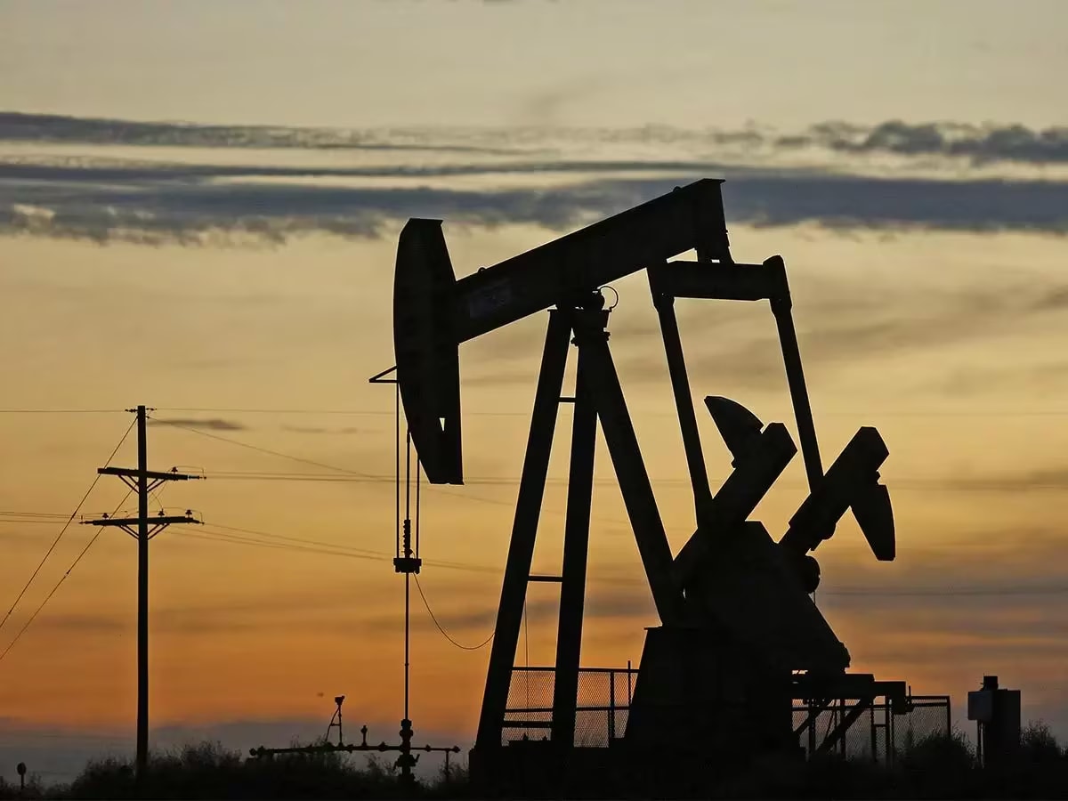 Oil pump jack at sunset